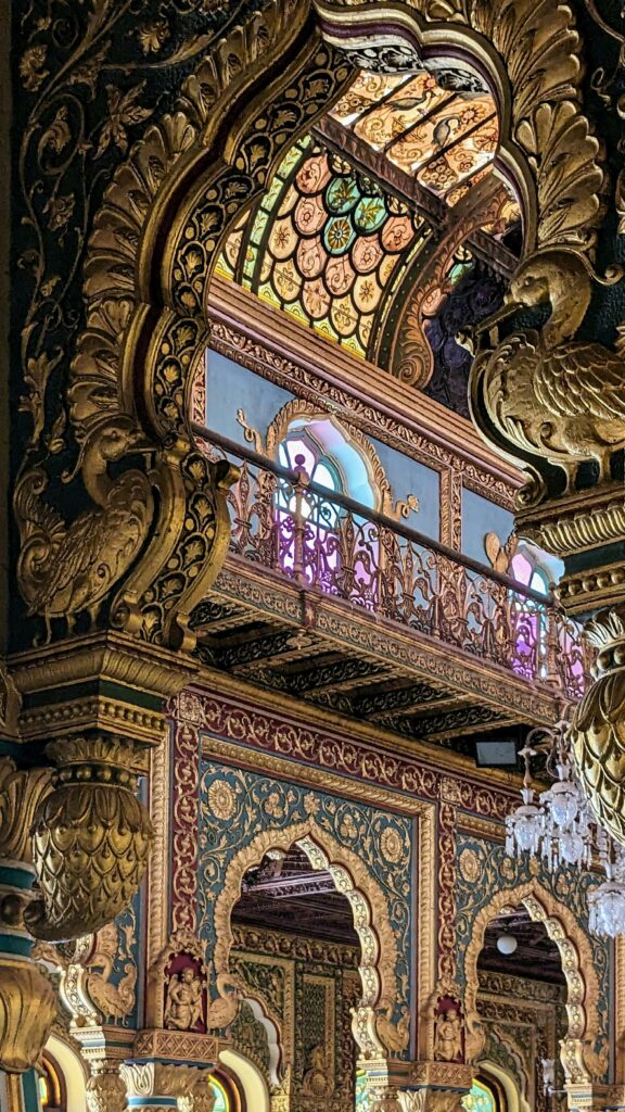 Explore the rich, ornate interior decoration of Mysuru Palace, India.