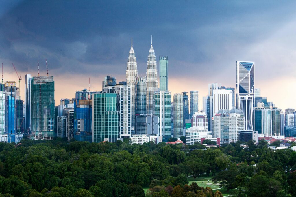 Breathtaking Kuala Lumpur skyline featuring the iconic Petronas Twin Towers amidst modern skyscrapers.