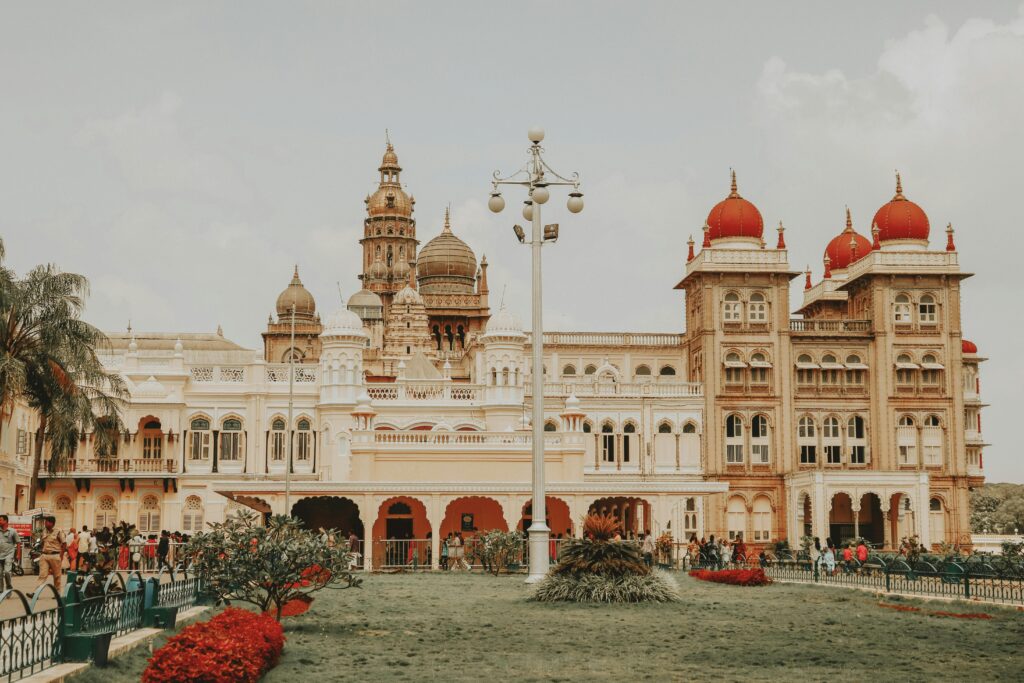 Mysore Palace's iconic architecture attracts tourists in Karnataka, India.